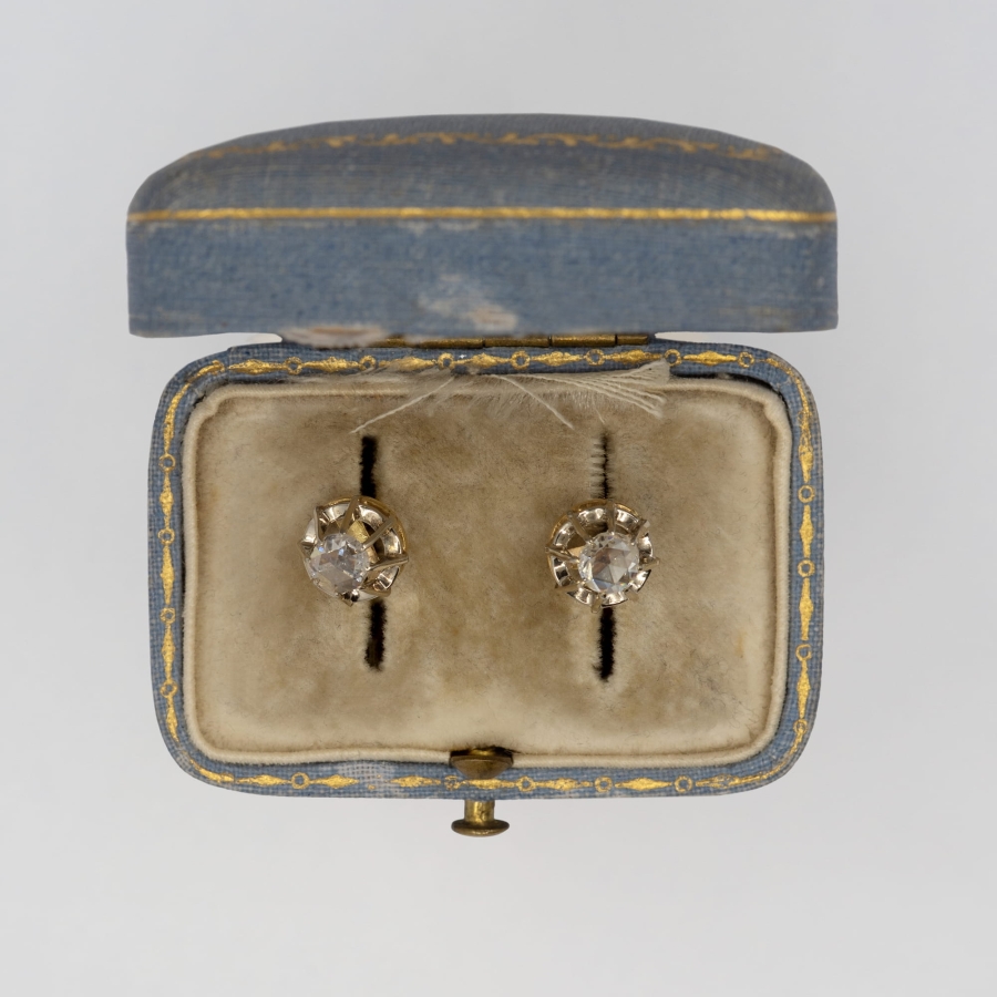 Vintage gold earrings with diamond rosettes.